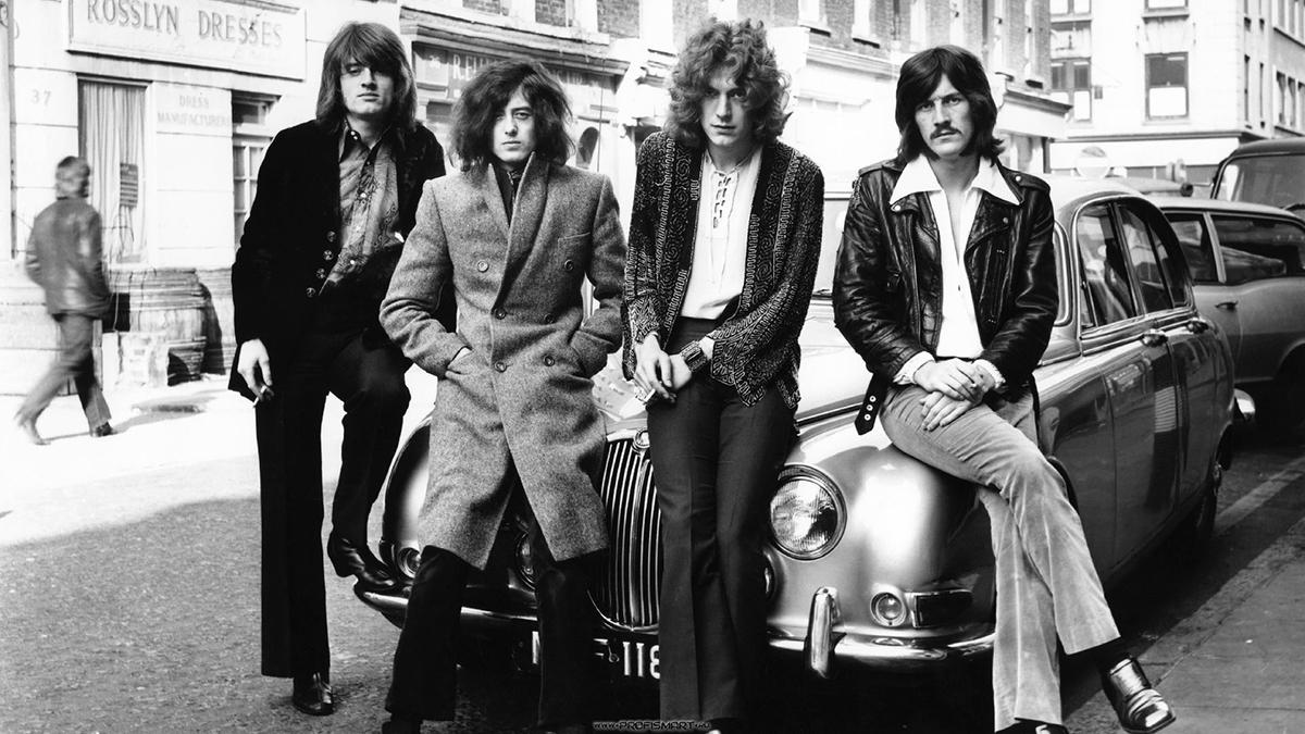 John Paul Jones, Jimmy Page, Robert Plant and John Bonham sit on the hood of a car at their first WEA photo shoot in London, December 1968. Photo: Dick Barnatt