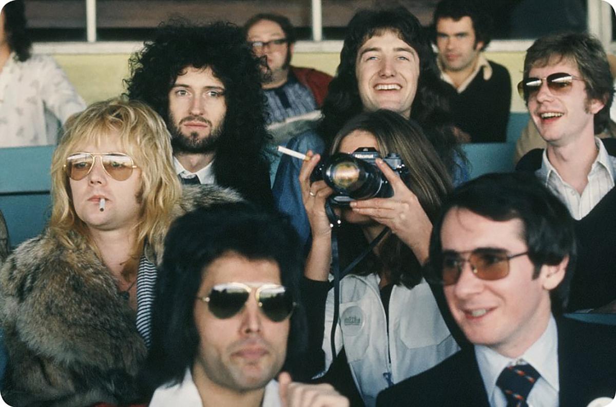 Queen (Freddie, Roger, Brian, John) enjoy a beautiful day in Kempton Park with their manager John Reid (bottom right)