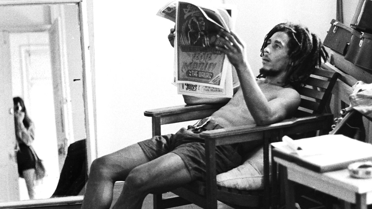 Bob Marley reading a newspaper