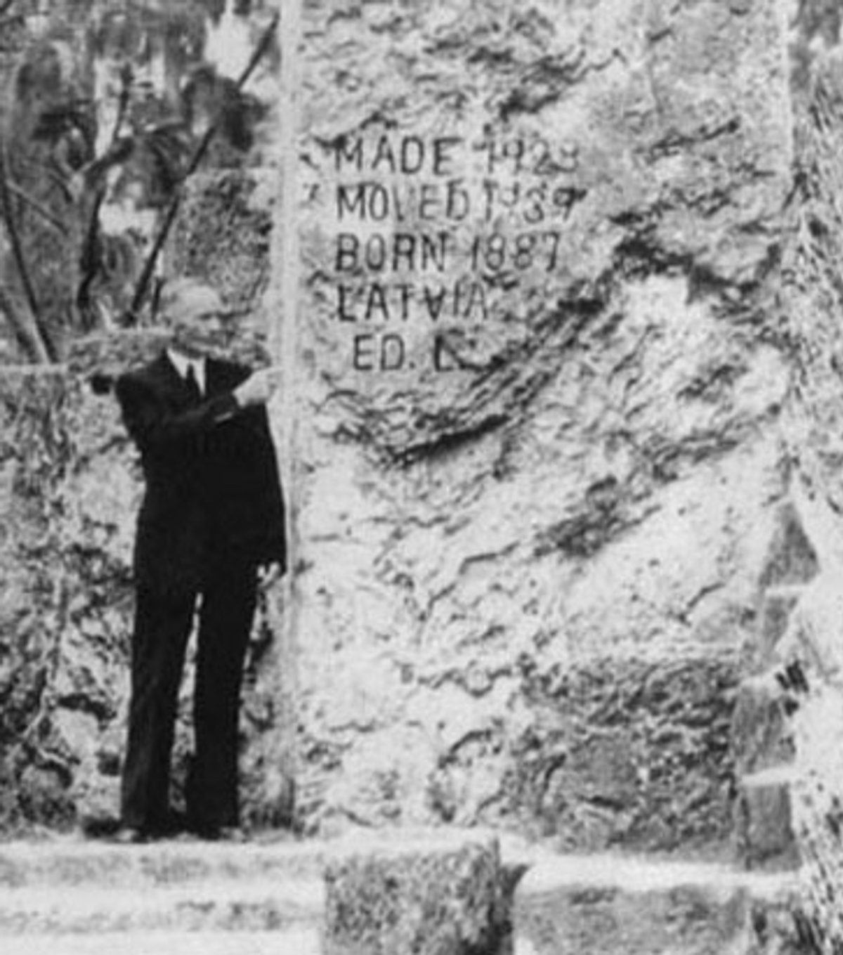 Edward Leedskalnin poses at the 12-meter obelisk in the castle grounds. Edward's initials are carved on the obelisk, as well as the year of his birth, the year the construction began and the castle was moved.