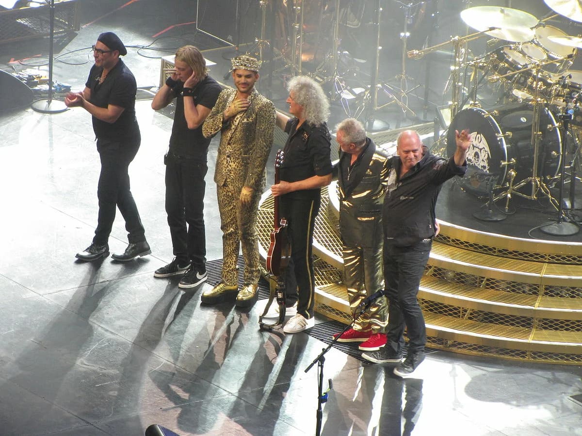 New lineup: Spike Edney - keyboards, Neil Fairclough - bass guitar, Rufus Tiger Taylor - drums, additional drums, Brian May - electric guitar/acoustic guitar, Roger Taylor - drums, percussion, Adam Lambert - lead vocals