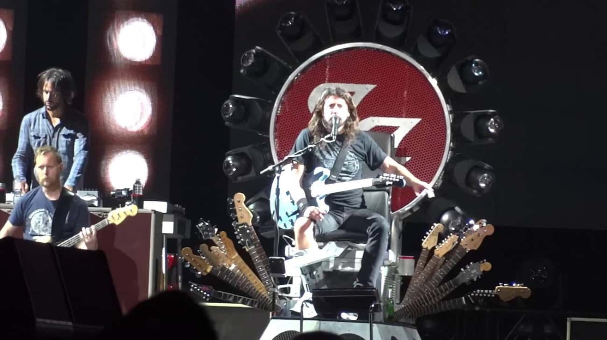 Dave Grohl with a broken leg on stage