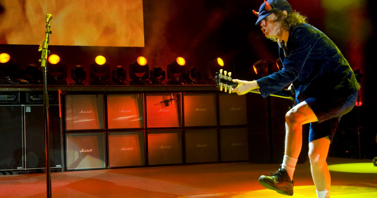 Duck walk performed by Angus Young