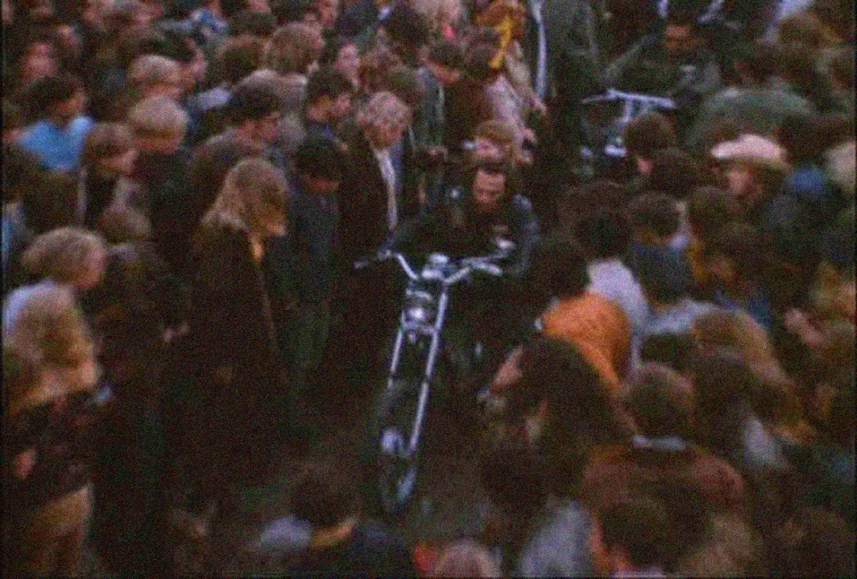 Altamont 1969 Hells Angels ride motorcycles through the crowd